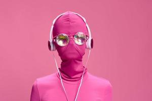 Creative crazy pink photo on a pink background with pink clothes and accessories, cyberpunk concept and conceptual art photography