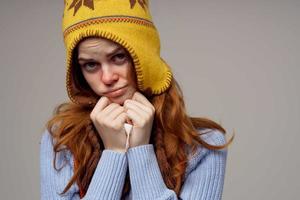 red-haired woman neck scarf with a hat on his head isolated background photo