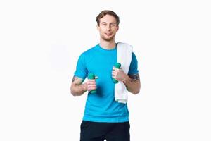 man with dumbbells in hands workout fitness exercise light background photo