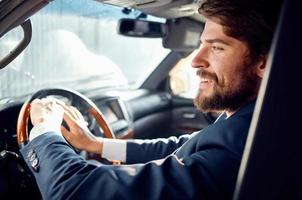 bearded man Driving a car trip luxury lifestyle service photo