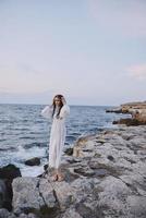 Beautiful woman walks volcanic rock formations on the island nature photo