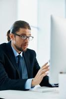 business man wearing glasses work desk computer office manager photo