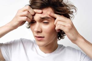 guy with tousled hair pimples on the face teenager skin problems photo