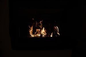 hot fire burning in a domestic fireplace on a winter day photo