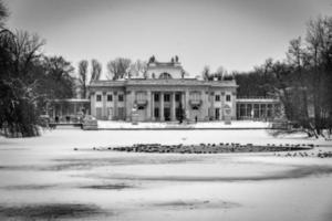 historic palace on the water in  in Warsaw, Poland during snowy winter photo