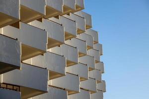 interesting original elements of the balconies in the white building photo