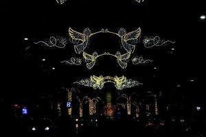 Christmas illuminations in Alicante Spain in the streets at night photo