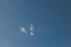 blue sky with one white small cloud natural background photo