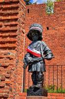 a monument to the little insurgent Warsaw in the Old Town in Warsaw photo
