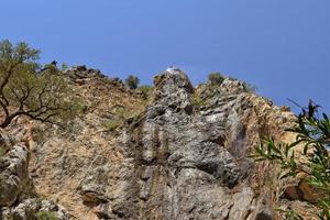 a natural wild landscape in the Turkish mountains with an interesting waterfall and the sapadere canyon photo