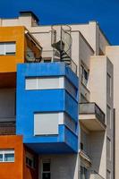 abstract colorful building in Alicante Spain over blue sky background photo