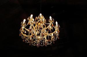 large crystal chandelier on a dark background photo