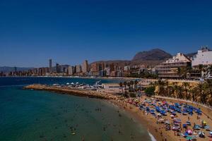 landscape beach in benidorm spain on a warm summer holiday day photo