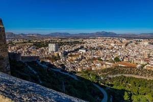 view on a sunny day of the city and colorful buildings from the viewpoint Alicante Spain photo