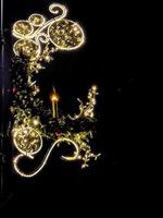 light illumination for christmas decorative candle on black smooth background photo