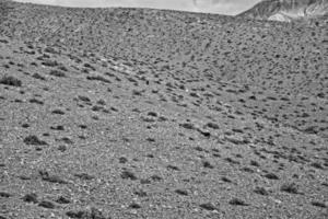 empty mysterious mountainous landscape from the center of the Canary Island Spanish Fuerteventura with a cloudy sky photo