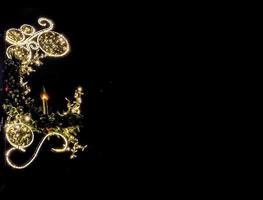 ligero iluminación para Navidad decorativo vela en negro suave antecedentes foto