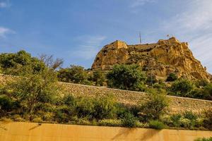 castle of saint barbara in alicante spain against blue sky landmark photo