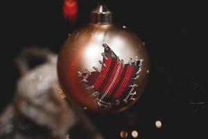christmas bauble  on a festive background photo