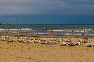 seaside landscape with a beach with sunbeds and the sea in no people photo