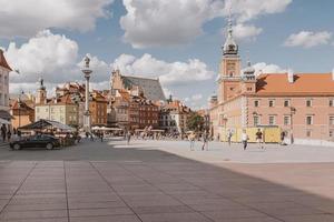 landscape from the square of the old town of Warsaw in Poland with the royal castle and tenement houses photo