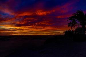 colorful sunset on the Spanish island of Gran Canaria in the Maspalomas dunes photo