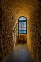 background illuminated window by the sun in a stone old castle and drawnianum with a chair background photo