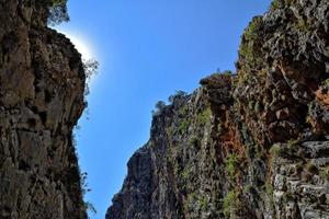 a natural wild landscape in the Turkish mountains with an interesting waterfall and the sapadere canyon photo