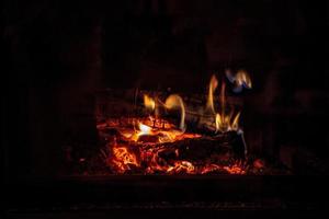 hot fire burning in a domestic fireplace on a winter day photo