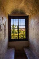 old stone alcove window background in historic castle with seating photo