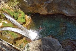 a natural wild landscape in the Turkish mountains with an interesting waterfall and the sapadere canyon photo