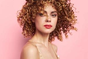 Beautiful woman Close-up curly hair portrait. bright makeup photo