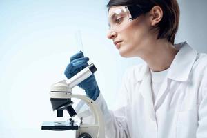 woman white coat laboratory microscope professional testing photo