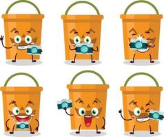 Photographer profession emoticon with halloween bucket cartoon character vector