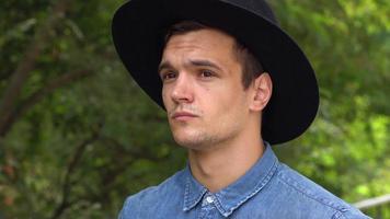 Portrait of young hipster man in hat video