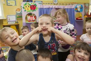 Cheerful children in kindergarten. A group of six-year-old boys and girls. photo