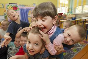 Cheerful children in kindergarten. A group of six-year-old boys and girls. photo