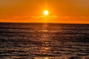 Sunset over the sea photo