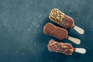 Summer Food Background. Eskimo ice cream in chocolate glaze. Yummy sweet food snack treat. Top view photo