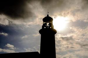 Lighthouse by the sea photo