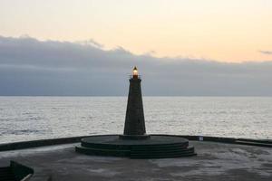 Lighthouse by the sea photo