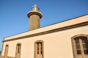 Lighthouse by the sea photo