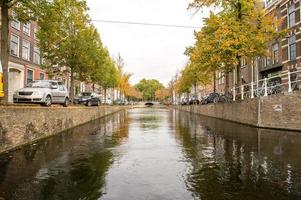 The Netherlands, Delft, October 2022. Canal Oude Delft in Delft canal boat cruise in autumn photo