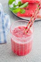 Healthy watermelon drink, smoothie, fresh watermelon on background. Summer Drink Concept. photo