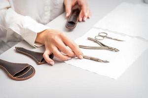 Manicurist lays out manicure set photo