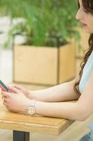 Young woman looking on smartphone photo