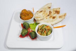 Chicken Harialy Kabab, Chicken Tikka masala curry, Indian Style mix vegetable , plain nan and Green Salad Platter. photo