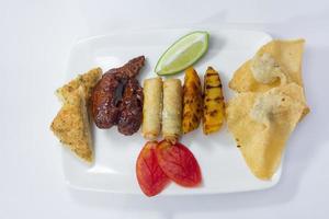 Auonthon, Spring roll, Prawn Toast, Grilled Potato and Buffalo wings Platter. photo