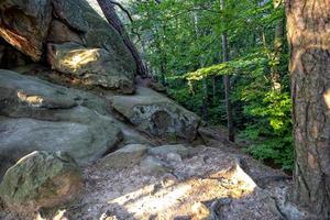 devil stone in a forest in the mountains of Pogorzyce in Poland on a summer day photo