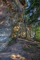 devil stone in a forest in the mountains of Pogorzyce in Poland on a summer day photo